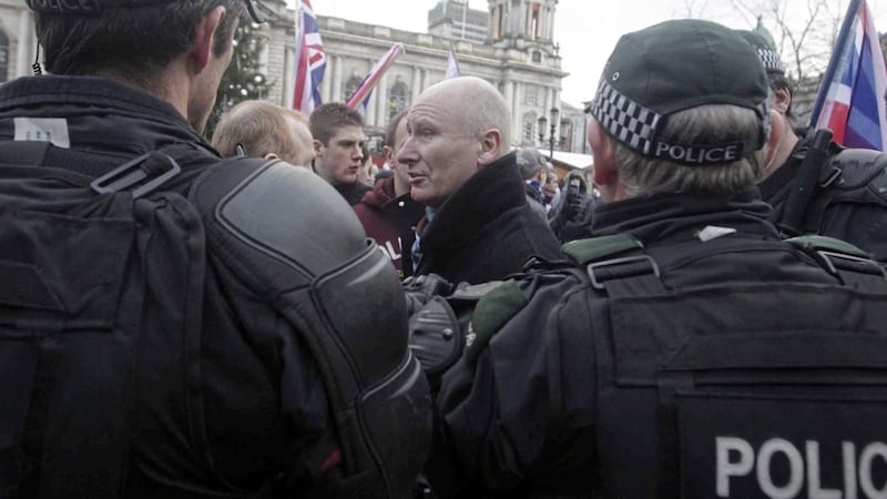 PUP leader Billy Hutchinson pictured in December 2012 at a loyalist flag protest talking to the police. 