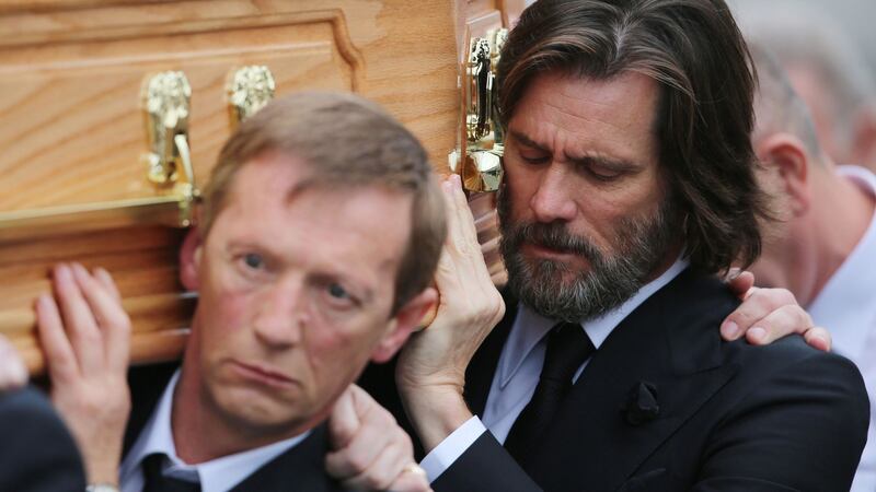 Jim Carrey right, carries the coffin of ex-girlfriend Cathriona White to Our Lady of Fatima Church, in her home village of Cappawhite, Co Tipperary ahead of her funeral in 2015. Picture by Niall Carson, Press Association&nbsp;