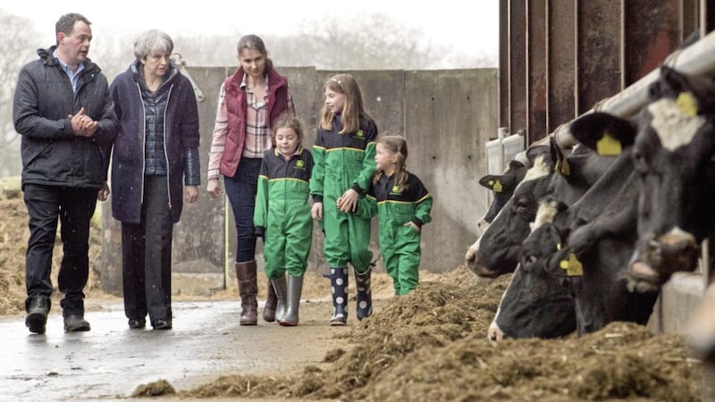 Prime Minister Theresa May is shown around Fairview Farm near Bangor by owners Stephen and Susanne Jackson and their daughters Hannah, Abbie and Emily 
