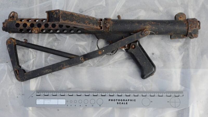A submachine gun was one of three weapons found by police.  