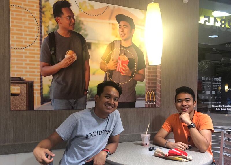 Jevh Maravilla and Christian Toledo with their picture in McDonald's
