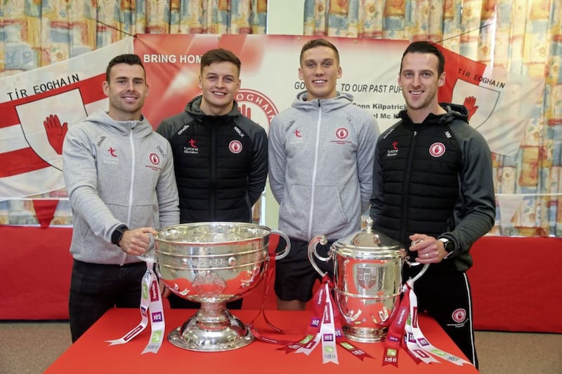 Past pupils of Edendork Primary School and Tyrone GAA players Darren McCurry, Shea Hamill, Conn Kilpatrick, Niall Morgan return to their former primary school with the Sam Maguire and Anglo Celt cups. Picture by Mal McCann. 