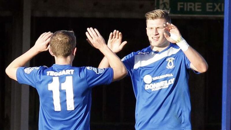 Dungannon&rsquo;s Andrew Mitchell (right) celebrates scoring against Cliftonville during today's game at Stangmore Park.&nbsp;