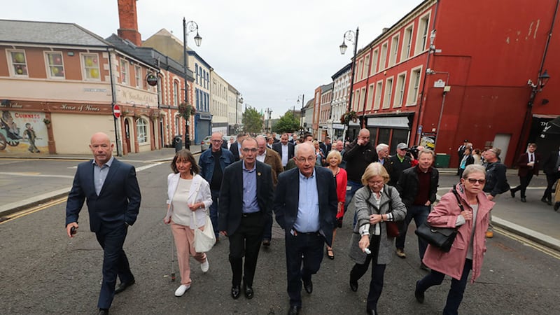 Members from the Wray and McKinney families and supporters walking to Derry Magistrates' Court, as the prosecution of a former soldier accused of two murders on Bloody Sunday will reach a courtroom for the first time&nbsp;