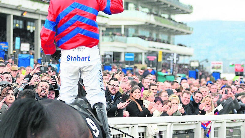Nico de Boinville celebrates after winning the Betway Queen Mother Champion Chase with Sprinter Sacre during Ladies Day of the Cheltenham Festival<br />Picture by PA