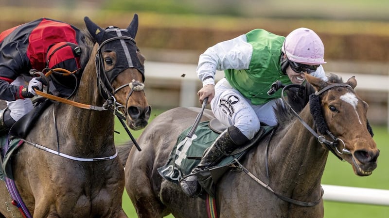 Dolly's Destination and Oran McGill wins the 2m6f handicap hurdle in Navan just as Glen and Errigal Ciaran come back out for the second half of their Ulster Club game. McGill could have been in Celtic Park but the horses come first now. Photo: Racing Post Photos 