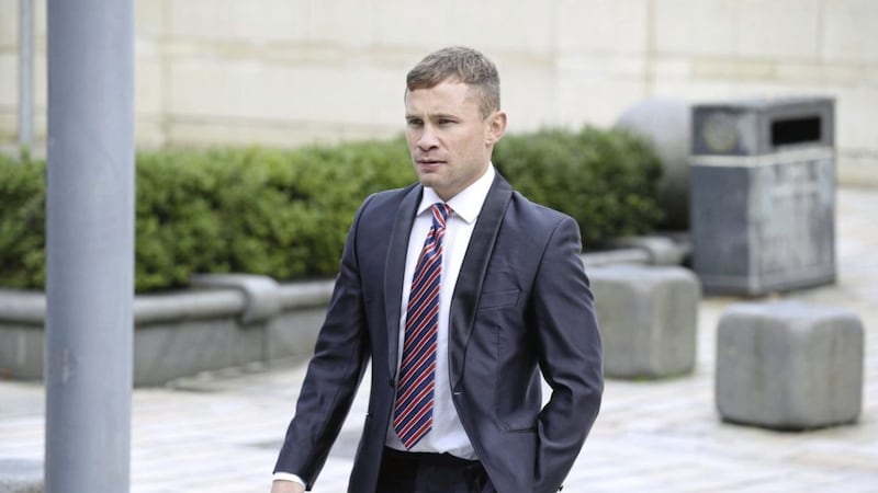 Boxer Carl Frampton on the way into the High Court in Belfast yesterday. Picture by Hugh Russell. 
