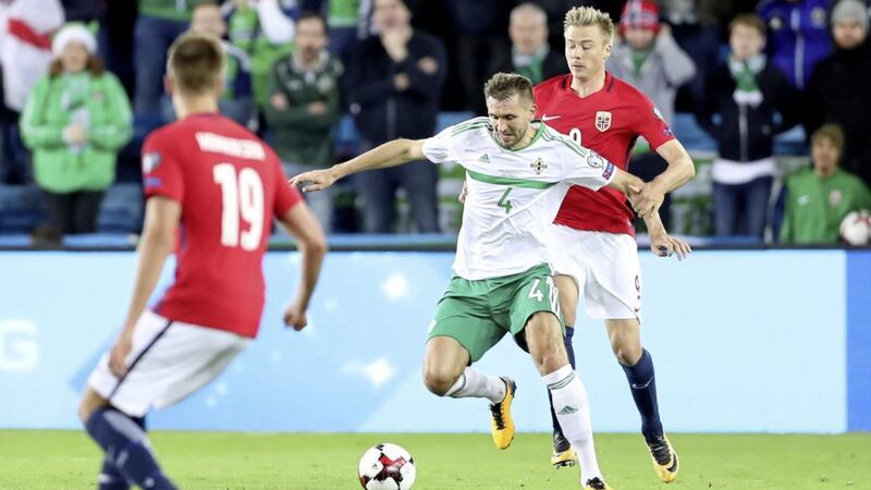 Northern Ireland&#39;s Gareth McAuley holds off Norway&#39;s Alexander Soderlund during a World Cup Qualifier at the Ullevaal Stadion, Oslo in 2017. Picture: William Cherry/Presseye. 