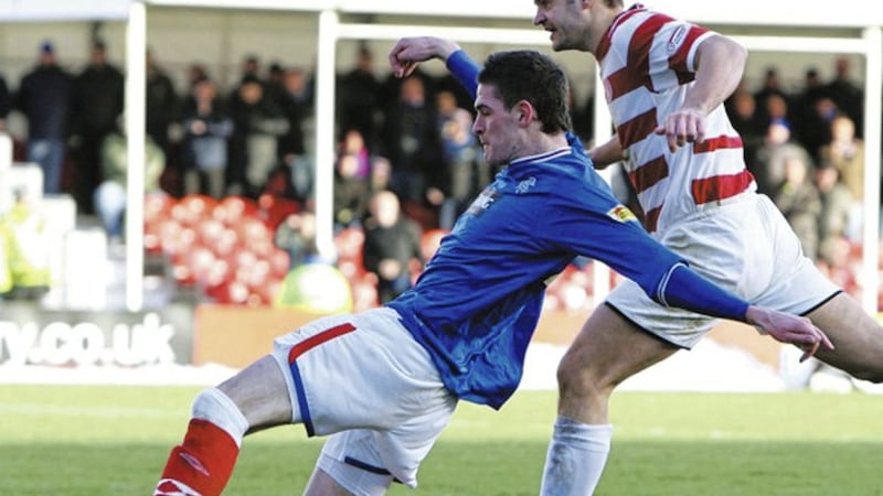 Rangers striker Kyle Lafferty (left) has a shot on goal during the Active Nations Scottish Cup fourth round match against Hamilton Academicals at New Douglas Park on January 10 2010 