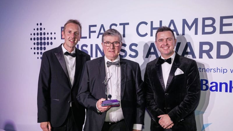 Trevor Annon (centre), chairman of Mount Charles, with his lifetime achievement award. Looking on are Paul McClurg, head of business banking at Bank of Ireland, with Cool FM presenter Pete Snodden 