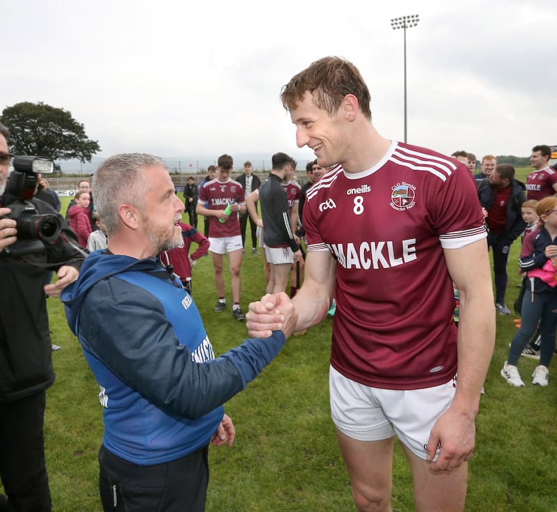 Michael McShane with Brendan Rogers after this year's Derry final, their 11th consecutive county title, nine of which McShane has been manager for. Picture: Margaret McLaughlin