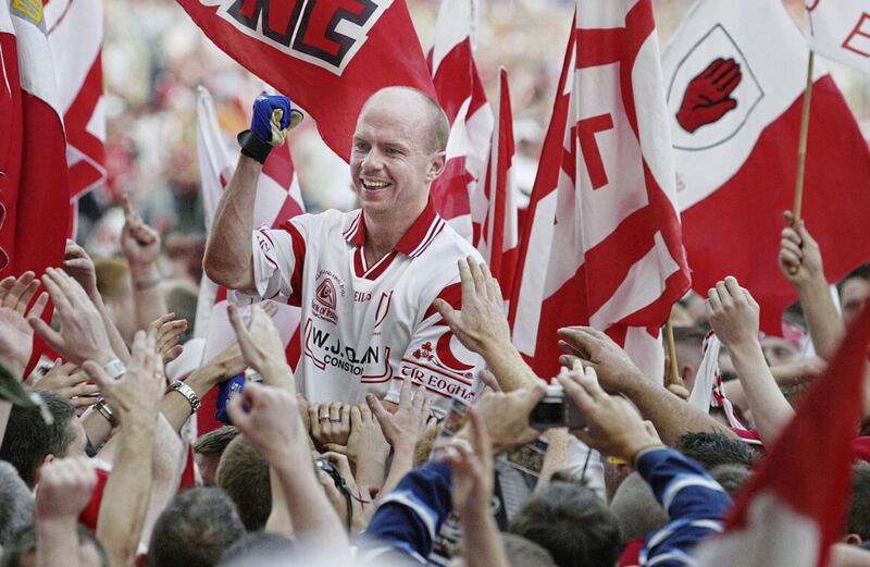 Peter Canavan is carried across the Croke Park pitch by Tyrone supporters after the 2003 final.