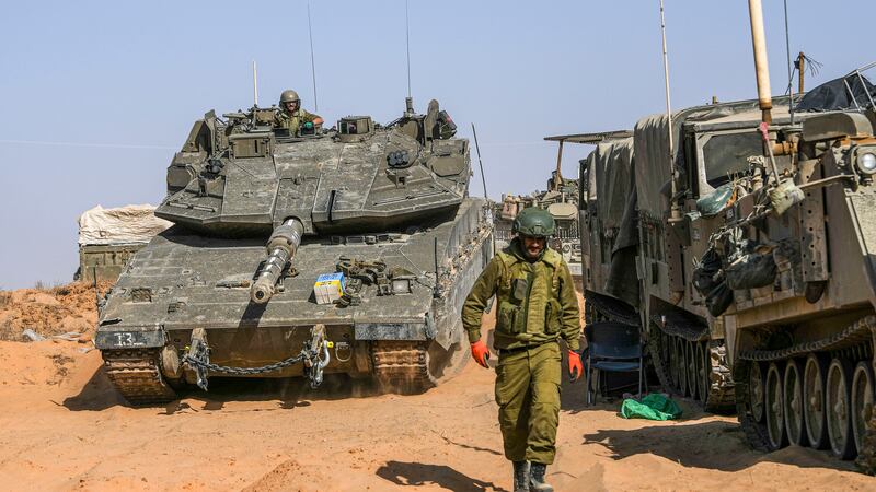 Israeli soldiers at a staging ground near the border with the Gaza Strip (Tsafrir Abayov/AP)