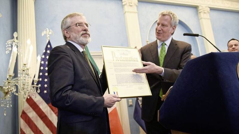 Gerry Adams receiving the proclamation from New York City mayor Bill de Blasio 