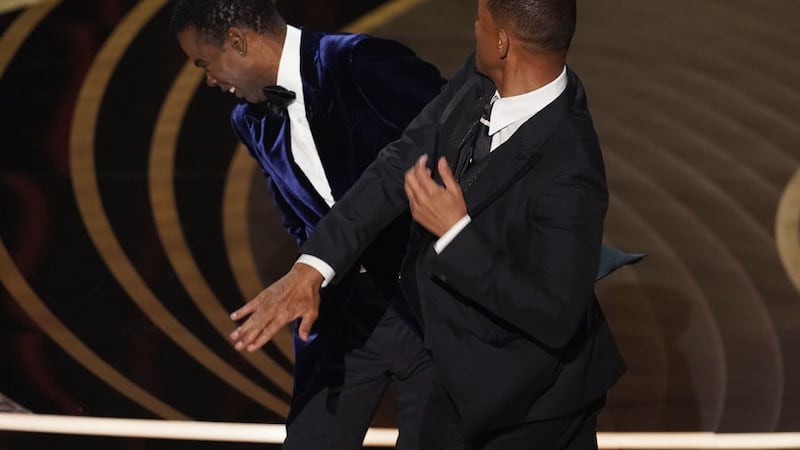 Will Smith slaps Chris Rock at the Oscars ceremony in Los Angeles. Picture by Chris Pizzello, Associated Press