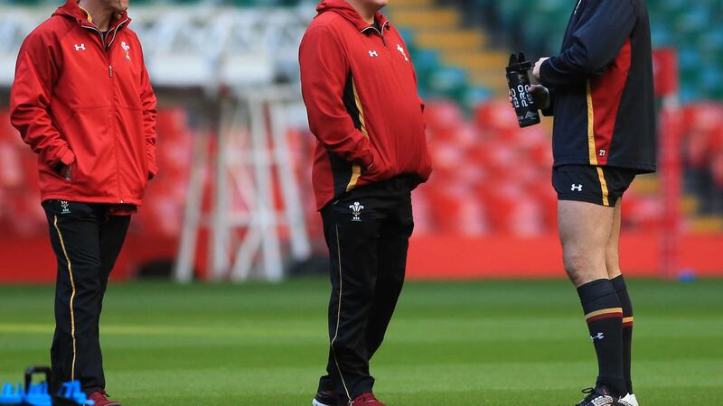 Wales head coach Warren Gatland and coach Rob Howley (left) speak with centre Jamie Roberts during a training session at the Principality Stadium, Cardiff on Wednesday<br />Picture by PA&nbsp;