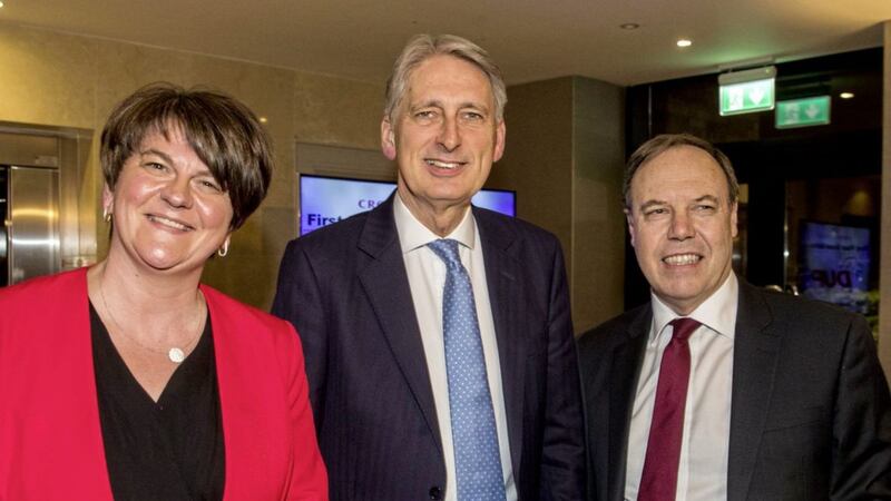 Chancellor of the Exchequer Philip Hammond (centre) at Crown Plaza Hotel in Belfast with the DUP leader Arlene Foster (left) and party deputy leader Nigel Dodds (right). Picture by Liam McBurney/PAWire 