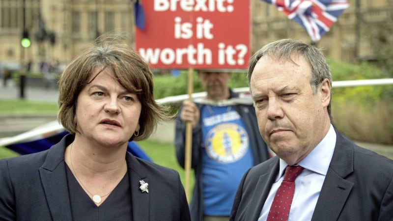 DUP leader Arlene Foster and deputy leader Nigel Dodds, pictured outside Westminster in 2018, met representatives of loyalist paramilitaries. Photo: Stefan Rousseau/PA Wire.