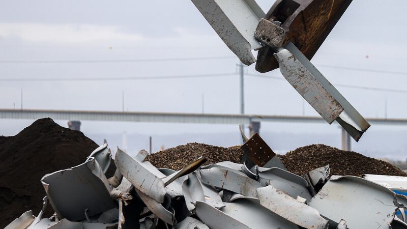 A shearer breaks apart salvaged pieces of the collapsed Francis Scott Key Bridge (AP)