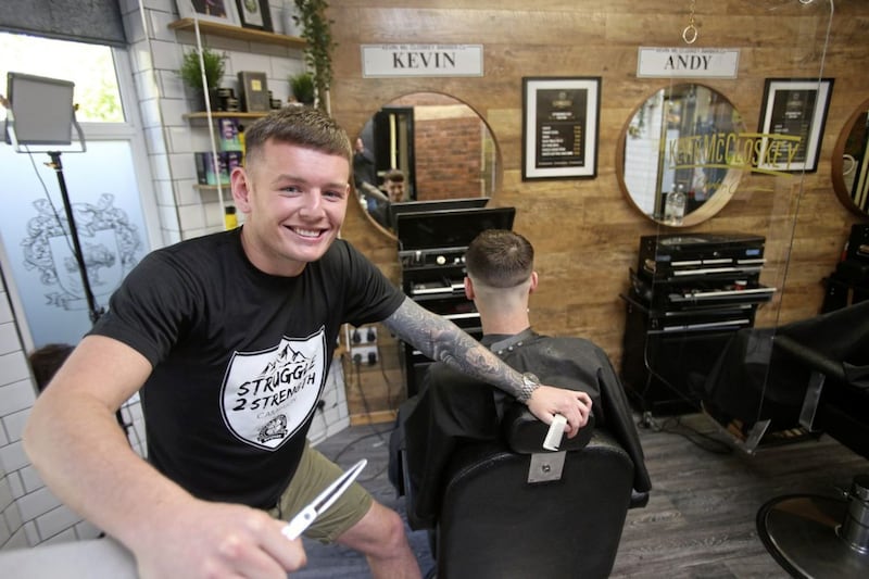 Barber Kevin McCloskey, who owns Kevin McCloskey BarberCo on the Antrim Road in north Belfast, has been offering free haircuts this week to anyone struggling with their mental health to co-incide with Mental Health Awareness Week. Picture by Mal McCann. 