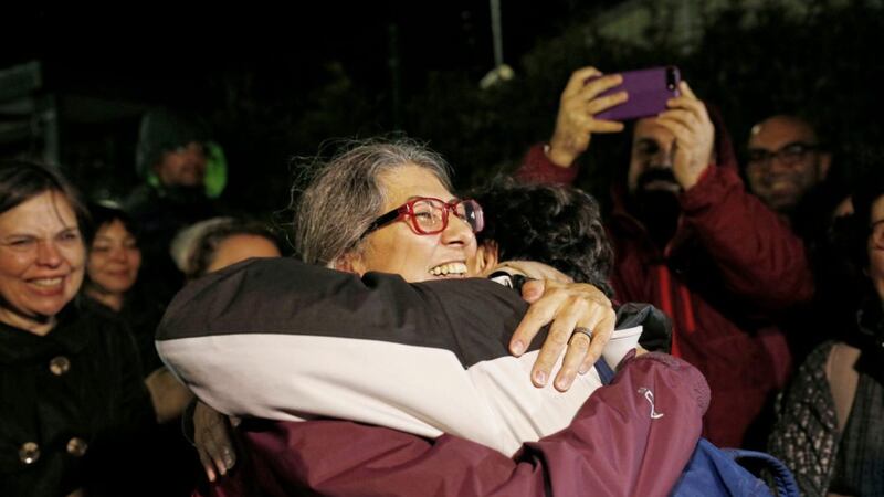 Activist Ozlem Dalkiran, centre, of the Citizens&#39; Assembly organization, hugs a colleague after her release from Silivri prison outside Istanbul PICTURE: Emrah Gurel/AP 