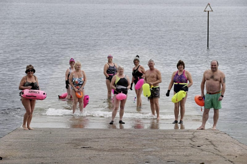Martin Strain and other members of the Donaghadee Chunky Dunkers get set to go for a swim in Donaghadee Harbour. Picture by Hugh Russell 