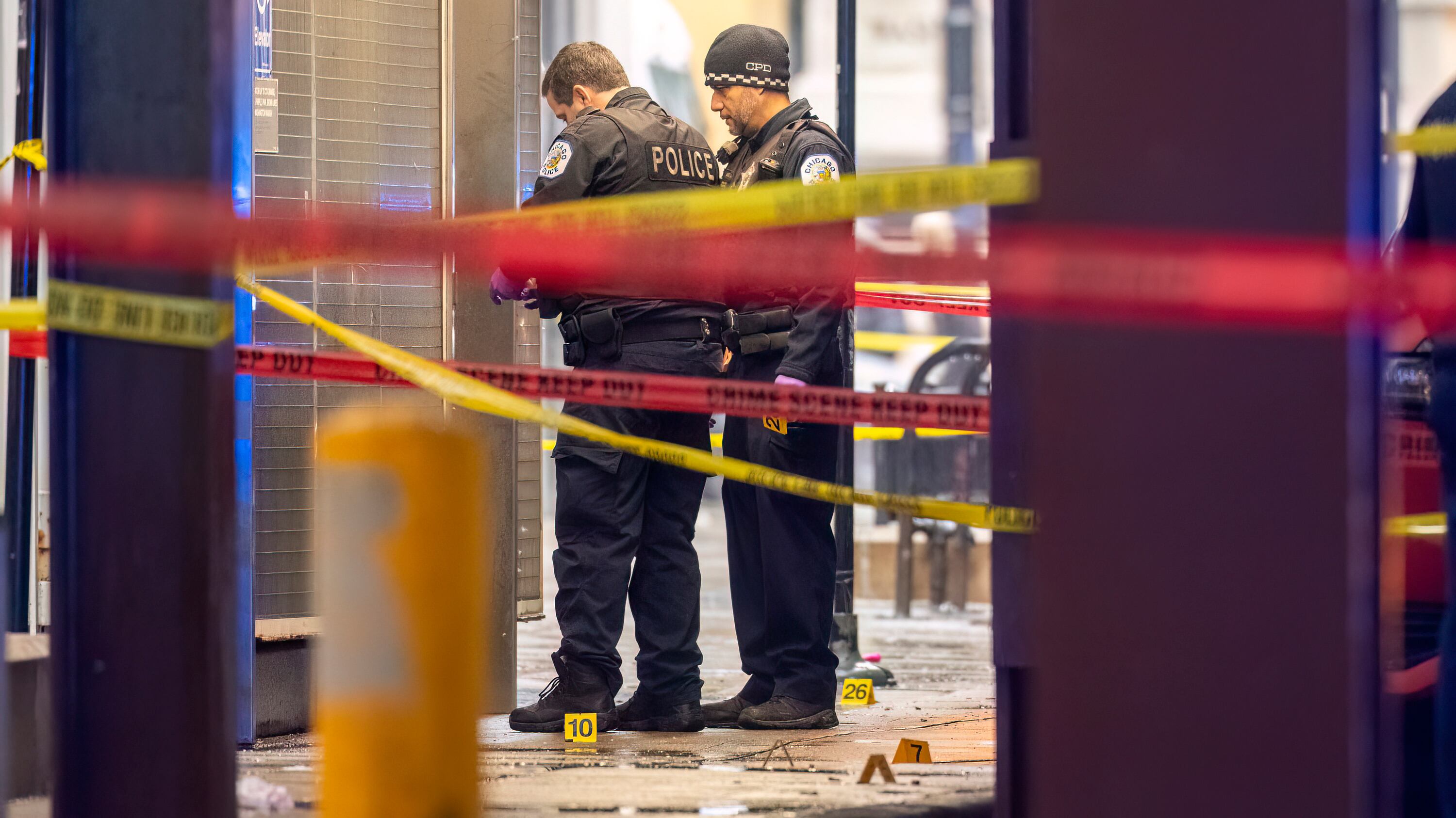 Chicago police working at the scene where two high school students were shot and killed in Chicago (Tyler Pasciak LaRiviere/Chicago Sun-Times via AP)