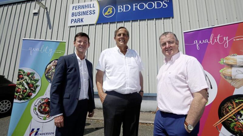 Tommy Bowe&#39;s father Paul (centre), pictured with Ron Whitten and Damien Barrett of the Henderson Group, when the acquisition was first announced in July 2019. 