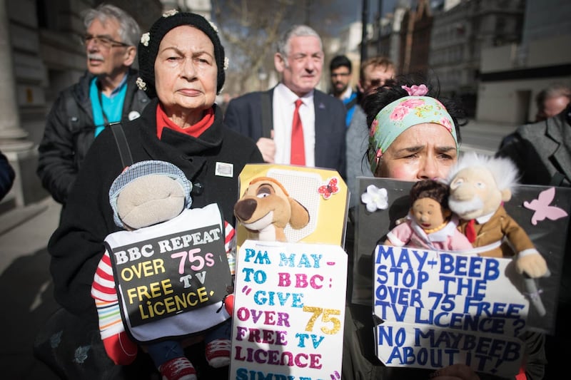 Members of the National Pensioners Convention (NPC) protest in Westminster at the government decision to pass responsibility for funding the TV licence for over-75s onto the BBC (