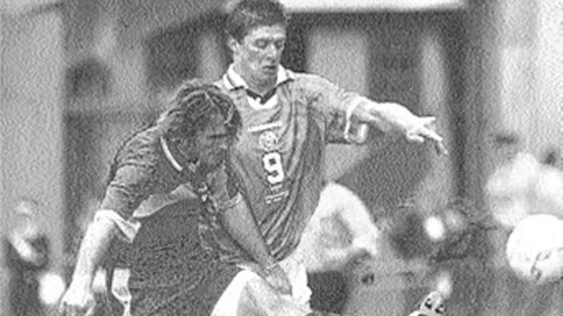 NAILED BY NIALL... Irish striker Niall Quinn tackles Macedonia&rsquo;s Goran Stavreski during Ireland&rsquo;s win in their Euro 2000 qualifier at Lansdowne Road last night 