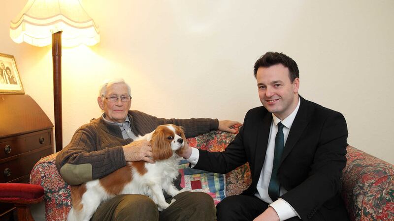 Former Deputy First Minister Seamus Mallon and SDLP leadership candidate Colm Eastwood with Jessie, Mr Mallon's King Charles Spaniel. Picture by Cliff Donaldson&nbsp;