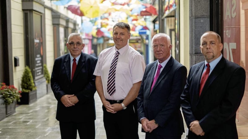Mercury Security Management contracts manager, Ronnie Heaney (centre-right), is joined by Market Cross Centre manager, John Chatten (centre-left) and Mercury Security officers James Coffey and Liam Dwyer to announce that Mercury has secured a new deal to supply a core team of expertly equipped and fully trained security officers to provide manned guarding services at Market Cross Shopping Centre in Kilkenny. 