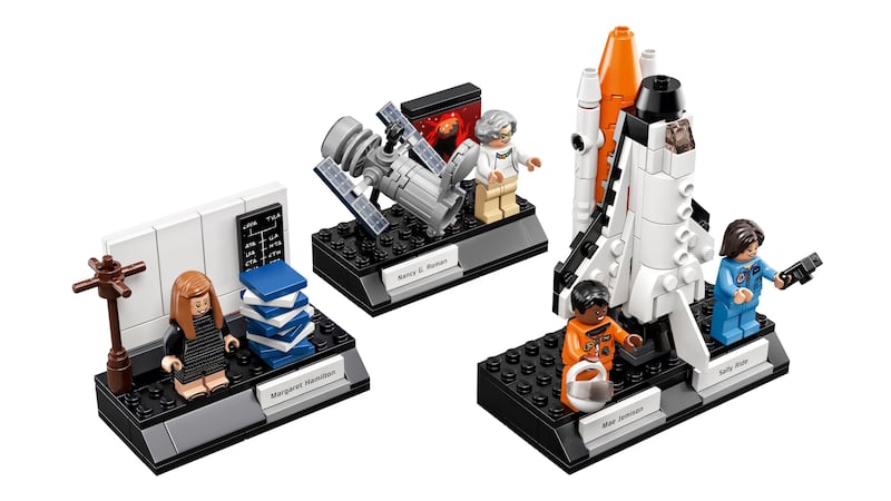 The minifigures include a computer scientist, a physicist and two astronauts.