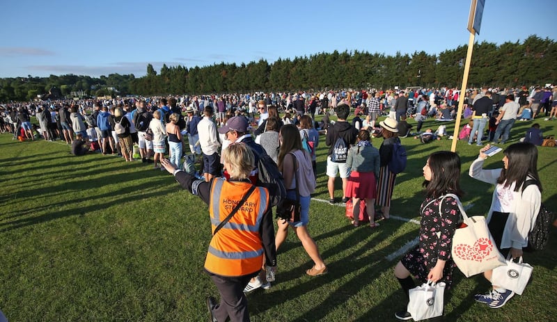 People arrive to join ticket queues in Wimbledon Park