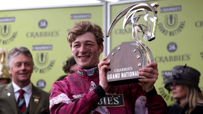 Jockey David Mullins with the trophy after winning the Crabbie's Grand National Chase on Rule The World at&nbsp;Aintree&nbsp;