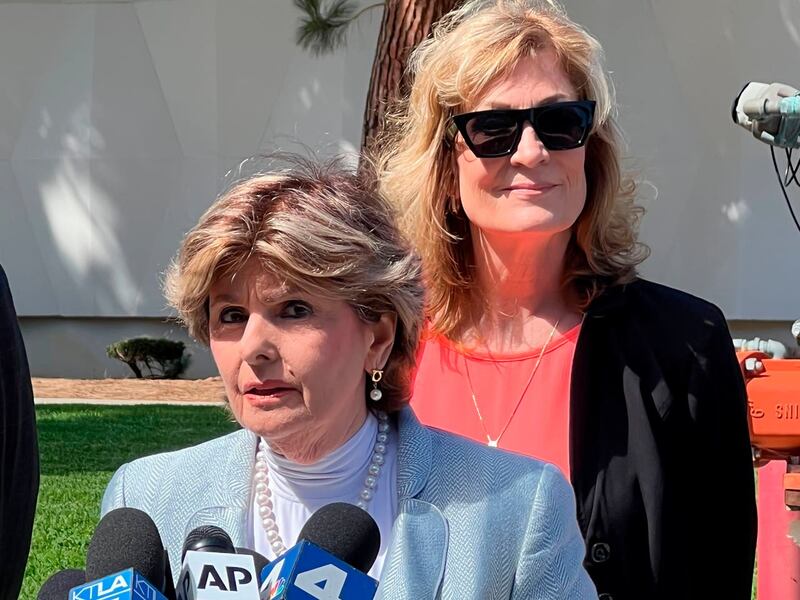 Attorney Gloria Allred speaks as Judy Huth looks on following a verdict in Huth’s favor in a civil trial involving actor Bill Cosby outside the Santa Monica Courthouse on Tuesday, March 21, 2022