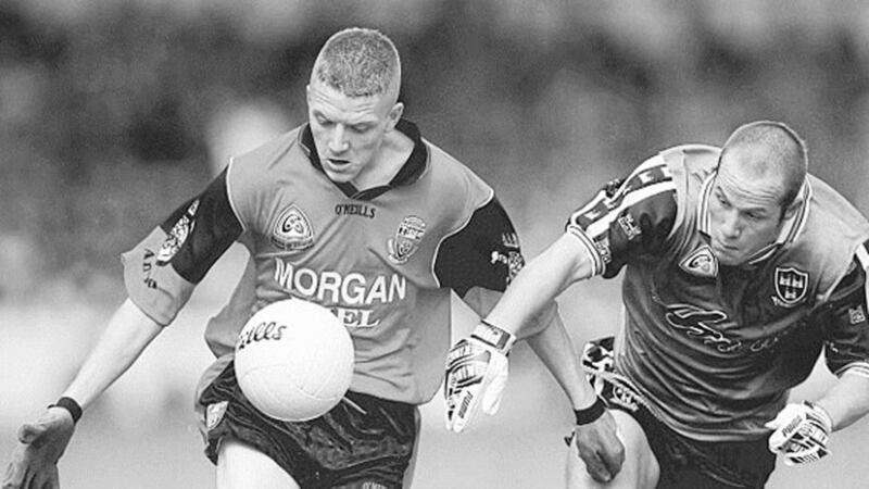 CLOSE CONTROL...Down&rsquo;s John Fegan gets away from the attention of Dublin&rsquo;s Anthony Holly at Croke Park yesterday 