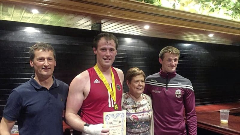 Patrick Rogers with brother Brendan, mum Bernie and dad Sean at the Dockers club last Friday night after his Ulster title win 