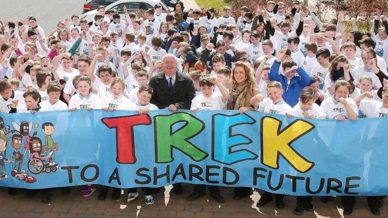 The Housing Executive&#39;s Liam Gunn and Lorraine Walsh with pupils at the Trek initiative event. Picture by Declan Roughan 