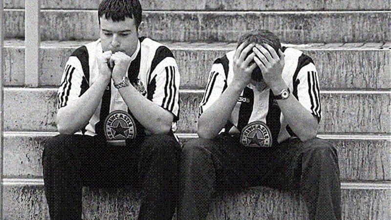 FALLEN IDOL...Newcastle fans Luke Westgarth and Andy Sherlaw wait anxiously for news outside St James&rsquo;s Park yesterday after Keegan&rsquo;s resignation 
