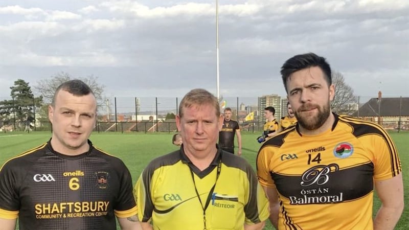 Laochra Loch Lao captain Sean McCurry (right) and St Malachy&rsquo;s captain Anthony Dobbin with referee Eamon Hamill before Wednesday night's match