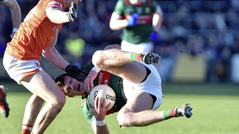 Armagh&#39;s Paddy Burns holds up Mayo&#39;s Jordan Flynn in yesterday&#39;s draw at the Athletic Grounds  Picture: John Merry