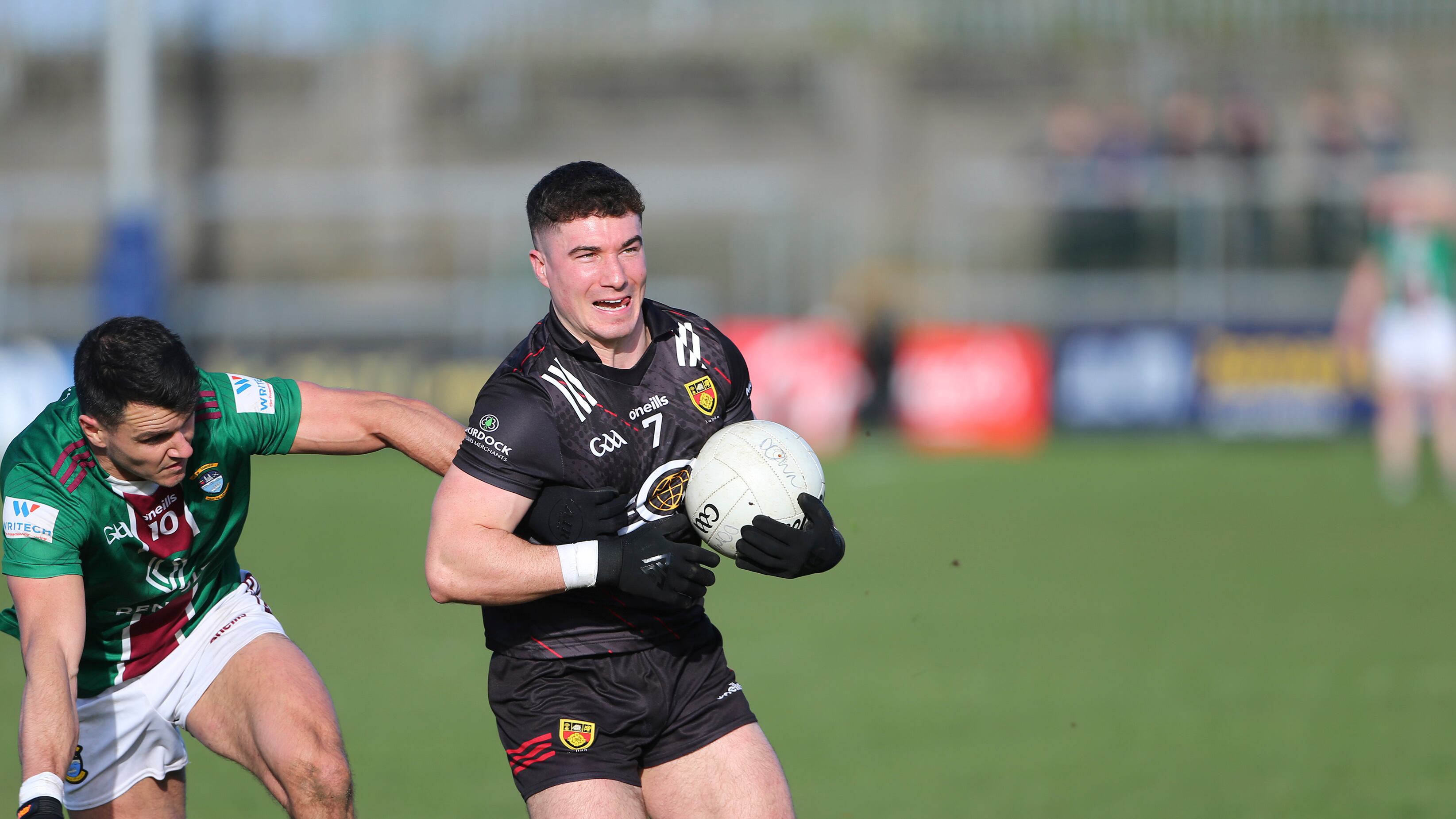 Down's Daniel Guinness gets away from Westmeath's David Lynch during Sunday's Allianz Football League Division Two match in Cusack Park, Mullingar
Picture: Louis McNally