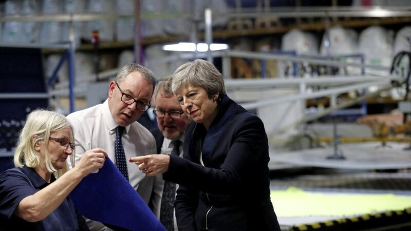 Prime Minister Theresa May visits the Scottish Leather Group Limited, in Bridge of Weir, Scotland. The Bank of England has warned that a no-deal scenario could see the UK&#39;s unemployment rate rise to 7.5 per cent, inflation surge to 6.5 per cent and interest rates rocket as high as 5.5 per cent Picture by Reuters/Russell Cheyne/PA 