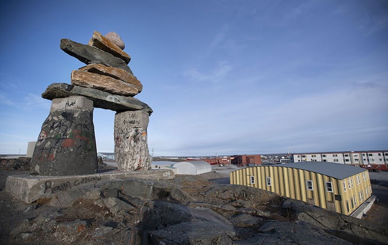 The Kivalliq Health Centre (top), and an Inukshuk in Rankin Inlet.