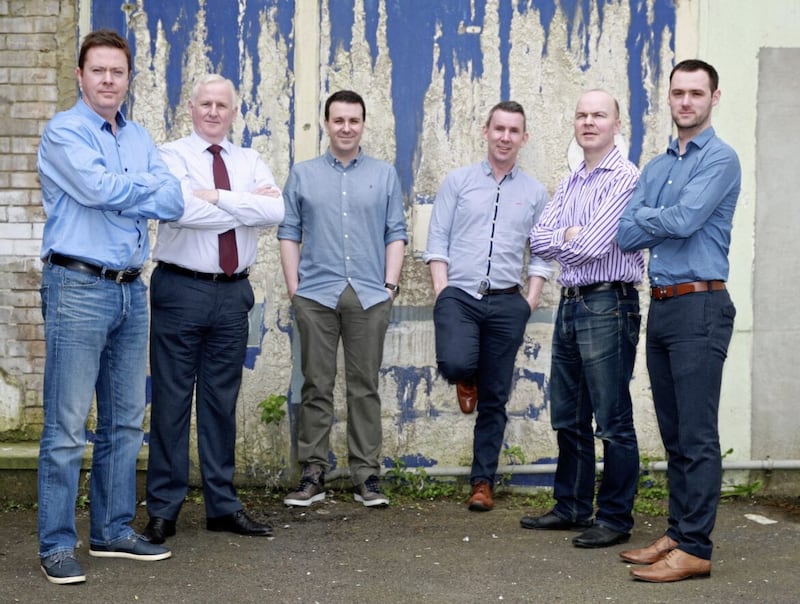 Former Irish News sports editor Thomas Hawkins (second from left) led the department for two decades 
