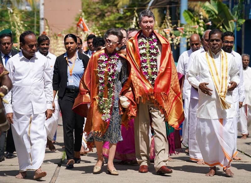 The Princess Royal and her husband Vice Admiral Sir Timothy Laurence during a visit to Vajira Pillayar Kovil Hindu temple in Colombo, Sri Lanka, on day three of their visit to the country