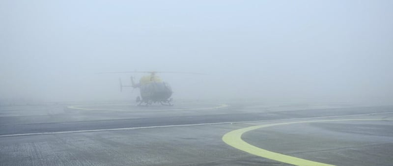 A grounded helicopter sits in the frozen fog at Belfast International Airport. Picture: PSNI 