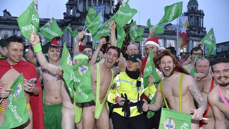 Colin Murray (front, centre) poses with supporters during his mankini-clad charity run through Belfast 