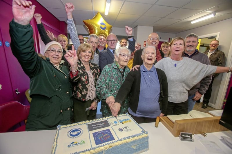 Cutting the cake at the new intergenerational centre of excellence in west Belfast following the refurbishment of a derelict building on the Falls Road. Picture Mal McCann. 